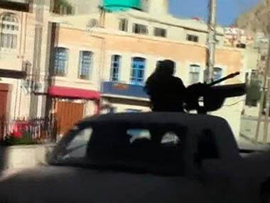 Image taken from video footage from a social media website shows a Syrian rebel vehicle with a heavy machine gun driving in Maaloula. Reuters