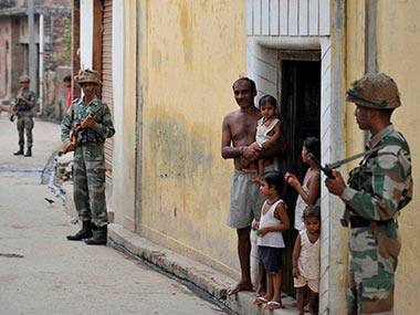 Security personnel keep vigil at Kudba village in violence-hit Muzaffarnagar district. PTI 