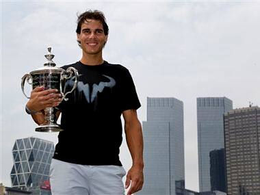 Rafael Nadal poses with the U.S. Open men's singles tennis tournament championship trophy at Central Park. AP