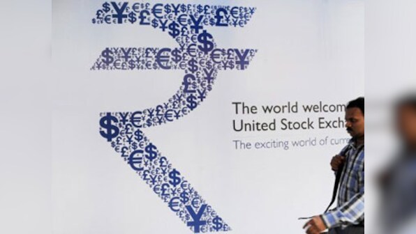 Rupee slumps 26 paise to close at historic low of 71 for first time against US currency
