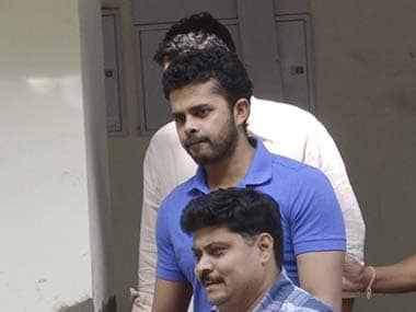 File photo of Sreesanth being escorted to court by the police in May. Reuters