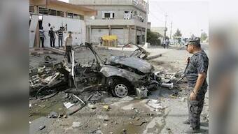 Suicide bombers kill six officers in Iraqi police station