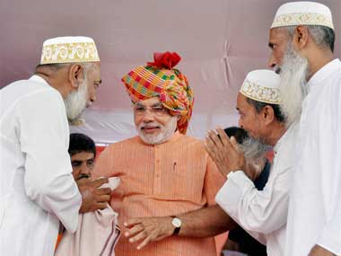 Modi with Muslims during his Sadbhavana Yatra. PTI. 
