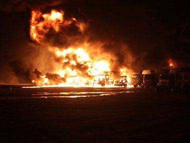 Militants set fire to 20 Nato tankers in Pakistan Militants set fire to 20 Nato tankers in Pakistan