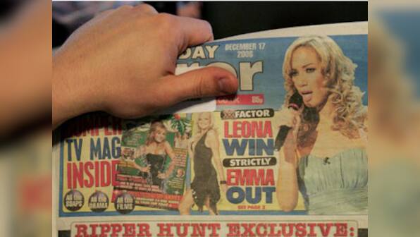 Publishers of UK's Sunday Mirror being questioned over phone hacking 