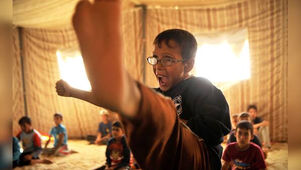 Photos: Syrian children learn Taekwondo in refugee camps