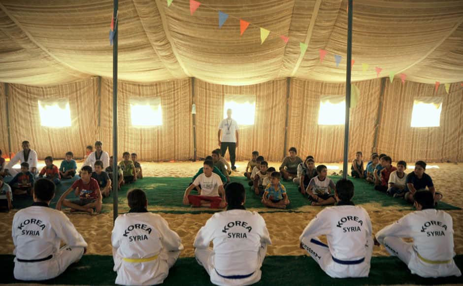 Koreans are also training adult refugees to give classes themselves to the children, who make up a majority of the camp, home to 120,000 Syrians who fled the military onslaught of President Bashar Assad. AP Photo/Bela Szandelszky. 