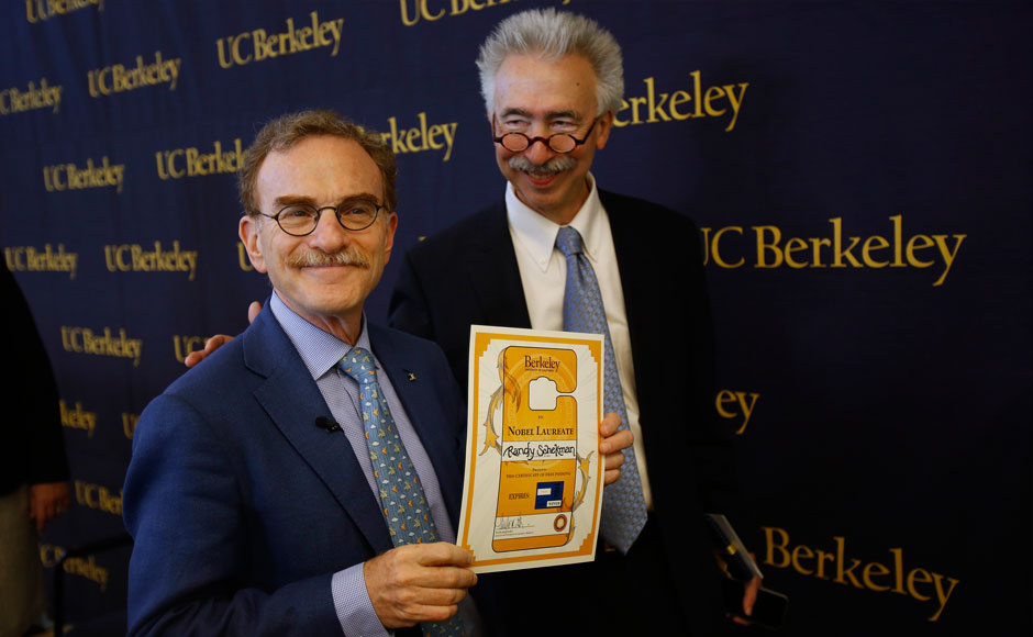 Randy Schekman (L), professor of molecular and cell biology at the University of California at Berkeley, holds a parking permit for Nobel laureate given by chancellor Nicholas B Dirks after a news conference in Berkeley, California. Americans Schekman and James Rothman and Germany's Thomas Suedhof won the 2013 Nobel medicine prize for their work on how hormones are transported within and outside cells, giving insight into diseases such as diabetes and Alzheimer's. Stephen Lam/Reuters Randy Schekman (L), professor of molecular and cell biology at the University of California at Berkeley, holds a parking permit for Nobel laureate given by chancellor Nicholas B Dirks after a news conference in Berkeley, California. Americans Schekman and James Rothman and Germany's Thomas Suedhof won the 2013 Nobel medicine prize for their work on how hormones are transported within and outside cells, giving insight into diseases such as diabetes and Alzheimer's. Stephen Lam/Reuters