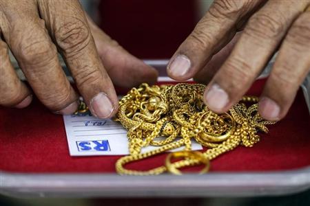 Gold set to end week lower; U.S. shutdown stems losses Gold set to end week lower; U.S. shutdown stems losses