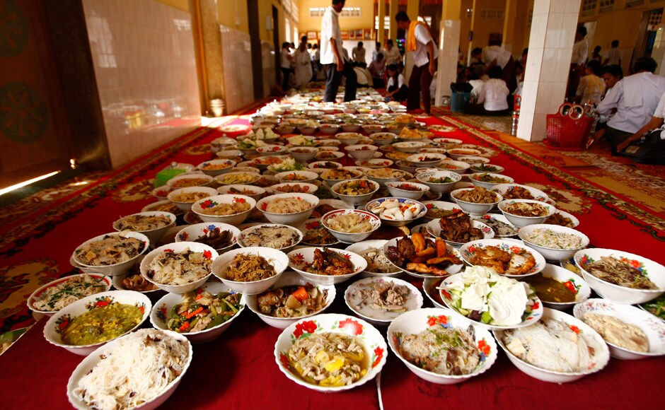 Buddhist followers prepare dishes for Buddhist monks during Pchum Ben, or Ancestors' Day, celebrations at a Buddhist pagoda in Kien Svay village, Kandal province, near Phnom Penh Cambodia, Sunday, Sept. 29, 2013. The traditional 15-day festival commemorates the spirits of the dead. (AP Photo/Heng Sinith) Buddhist followers prepare dishes for Buddhist monks during Pchum Ben, or Ancestors' Day, celebrations at a Buddhist pagoda in Kien Svay village, Kandal province, near Phnom Penh Cambodia, Sunday, Sept. 29, 2013. The traditional 15-day festival commemorates the spirits of the dead. (AP Photo/Heng Sinith)