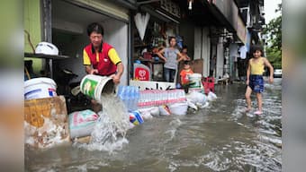 China sacks official who made flood victim carry him piggyback