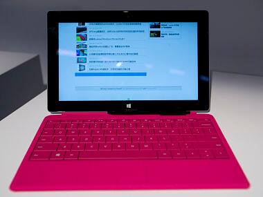 A new Surface tablet computer, with a pink Type Cover 2 are seen in this file photo. AP 