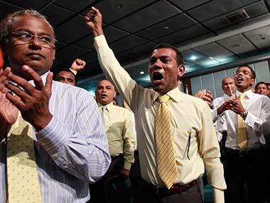 Former Maldivian president Mohamed Nasheed cheers as he arrives at a Maldivian Democratic party meeting in Male in this file photo.