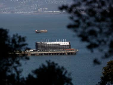 A barge built with four levels of shipping containers is seen at Pier 1 at Treasure Island in San Francisco. Reuters