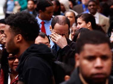 Jobseekers in US wait in a queue. Reuters