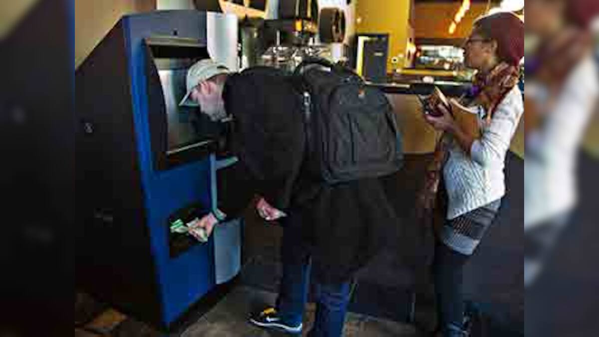 Bitcoin goes mainstream with ATM in Canada coffee shop – Firstpost