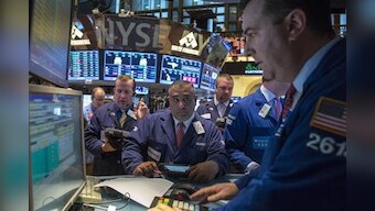 Euro drops from near 2-year high vs. dollar; Wall St up on earnings