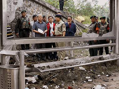 Deputy Chief Minister Gaikhangam inspecting Moirangkhom bus stand in Imphal which was rocked by a bomb blast. PTI