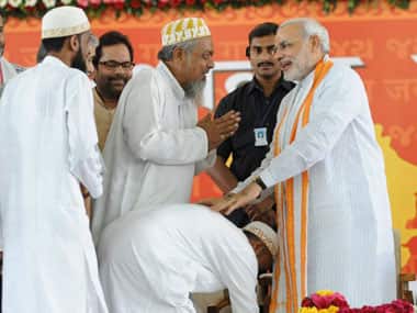 Narendra Modi with Muslim supporters. AFP.