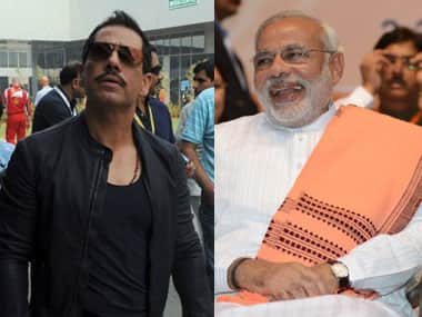Robert Vadra and Narendra Modi. AFP.