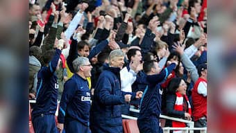 Wenger happy but plays down talk of title