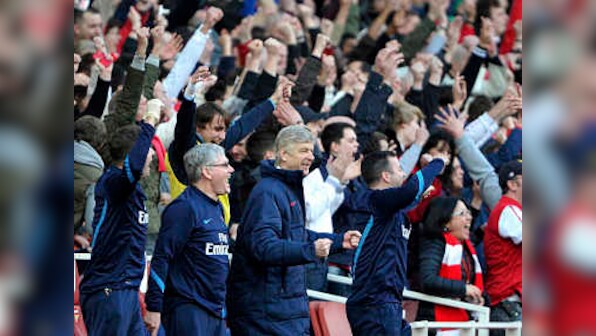 Wenger happy but plays down talk of title
