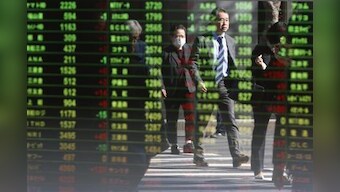 World stocks gain as Fed-fired volatility eases; dollar firm
