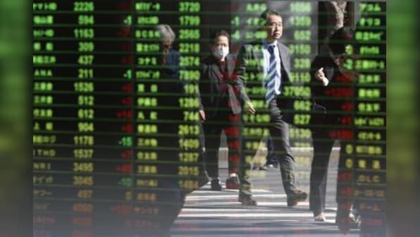 World stocks gain as Fed-fired volatility eases; dollar firm