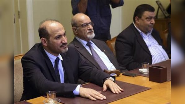 Syria opposition accepts peace talks, says Assad must go