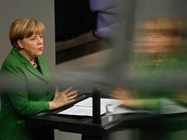 FILE - In a Monday, Nov. 18, 2013 photo, German Chancellor Angela Merkel delivers a speech at the German parliament Bundestag in Berlinin which she said the relationship between Germany and the United States as well as the future of a transatlantic free trade agreement have been 