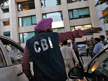 A Central Bureau of Investigation (CBI) official gestures outside the New Delhi office of the Abhijeet Group, which owns Jas Infrastructure, after conducting a raid on September 4, 2012. Federal law enforcement officials raided offices and homes in 10 cities across India on Tuesday as part of an investigation into irregularities in the award of coalfield concessions to private and state companies that has sparked a political crisis. Reuters
