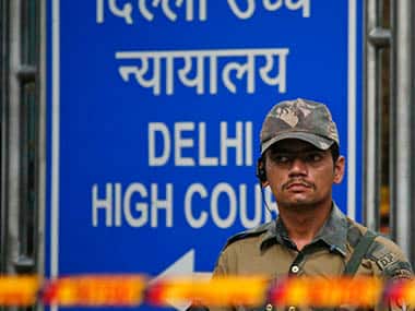 A police commando stands guard outside the High Court after Wednesday's bomb blast in New Delhi. Reuters