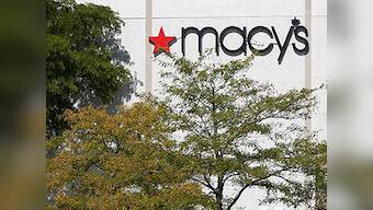 Dow ends at record highs in rally led by Macy's