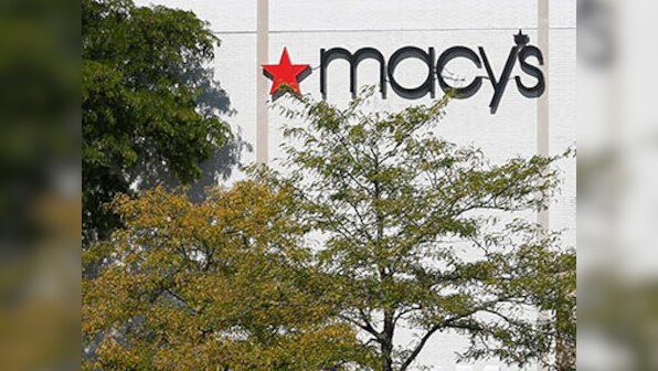 Dow ends at record highs in rally led by Macy's