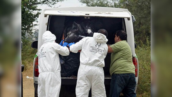 Count of bodies in Mexico mass graves rises to 42 