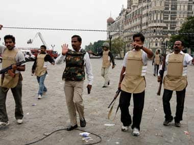 Policemen outside the Taj in Mumbai. Agencies. 