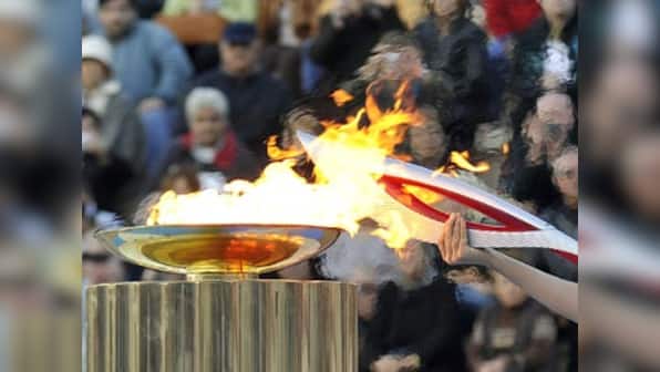 Olympic torch set for space as Russia struggles to keep it burning