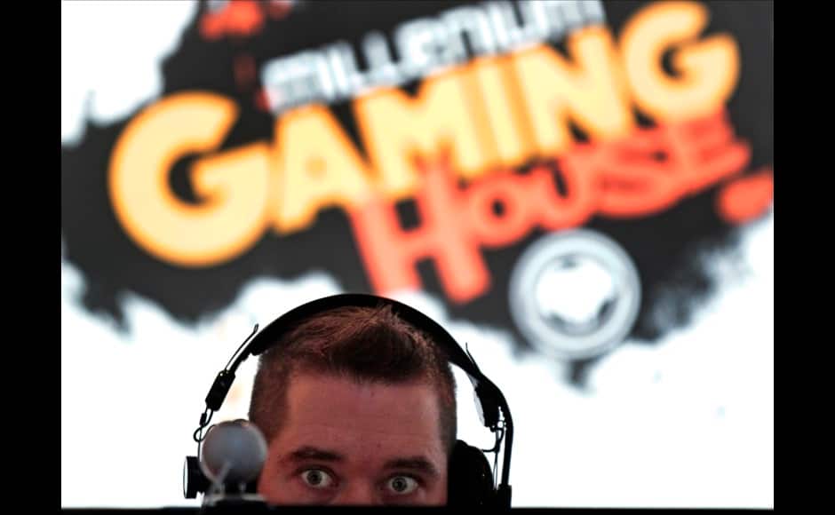 Millenium eSport professional gamer Benoit of France, nicknamed Adelscott, looks at a computer screen as he plays inside the Millenium Gaming House in Marseille November 12, 2013. The Millenium Gaming House, which opened its doors in Marseille in 2011, is the most important French e-sport organization and houses pro gamers who live, game, eat and sleep full-time in the building. The house is dedicated to the training of Pro Gamers teams for International competitions. Players train long hours to master the difficulties and subtleties of only one game and participate in Lan-Parties around the world. E-Sports earnings has ranked the 100 players with the highest overall earnings from competitive gaming, with over 60 gamers who have earned over $100,000 in prize money. Picture taken November 12, 2013. REUTERS/Jean-Paul Pelissier 