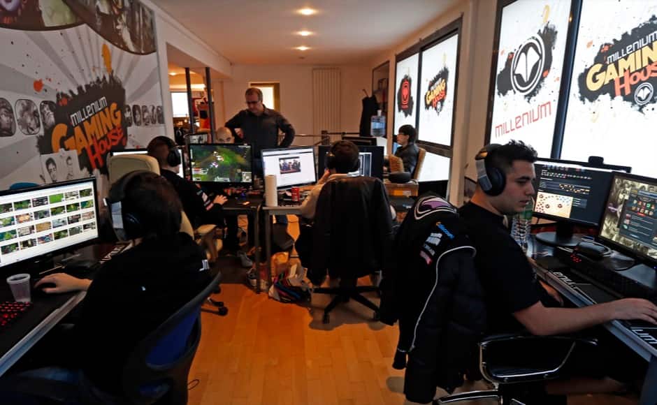 Millenium eSport professional gamers look at their computer screens as they play inside the Millenium Gaming House in Marseille November 12, 2013. The Millenium Gaming House, which opened its doors in Marseille in 2011, is the most important French e-sport organization and houses pro gamers who live, game, eat and sleep full-time in the building. The house is dedicated to the training of Pro Gamers teams for International competitions. Players train long hours to master the difficulties and subtleties of only one game and participate in Lan-Parties around the world. E-Sports earnings has ranked the 100 players with the highest overall earnings from competitive gaming, with over 60 gamers who have earned over $100,000 in prize money. Picture taken November 12, 2013. REUTERS/Jean-Paul Pelissier 