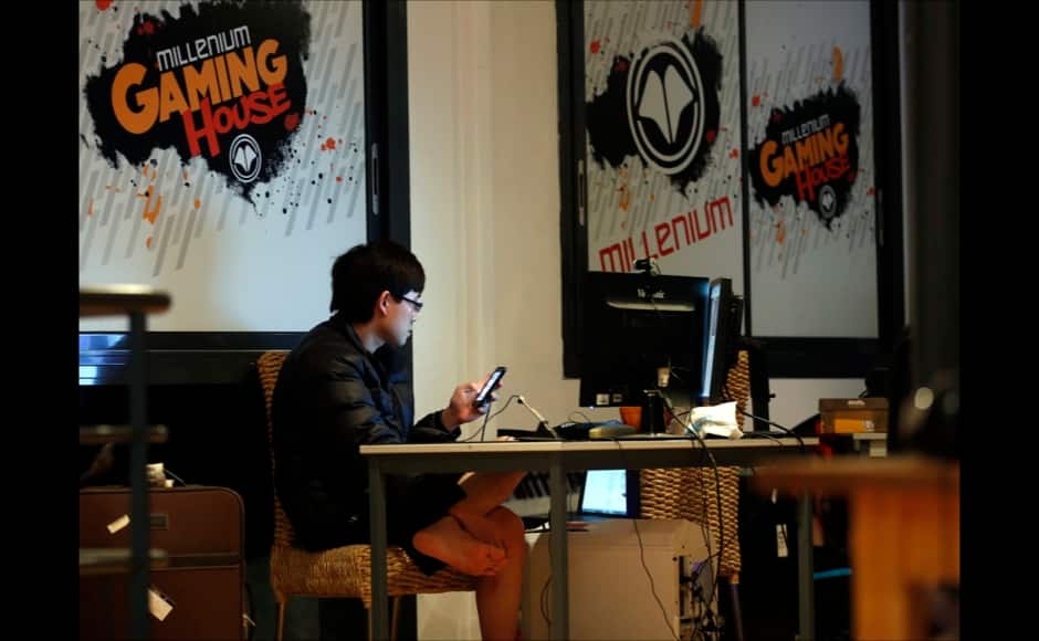 Millenium eSport professional gamer Park of South Korea, nicknamed fOrGG, looks at a computer screen as he plays inside the Millenium Gaming House in Marseille November 13, 2013. The Millenium Gaming House, which opened its doors in Marseille in 2011, is the most important French e-sport organization and houses pro gamers who live, game, eat and sleep full-time in the building. The house is dedicated to the training of Pro Gamers teams for International competitions. Players train long hours to master the difficulties and subtleties of only one game and participate in Lan-Parties around the world. E-Sports earnings has ranked the 100 players with the highest overall earnings from competitive gaming, with over 60 gamers who have earned over $100,000 in prize money. Picture taken November 13, 2013. REUTERS/Jean-Paul Pelissier 