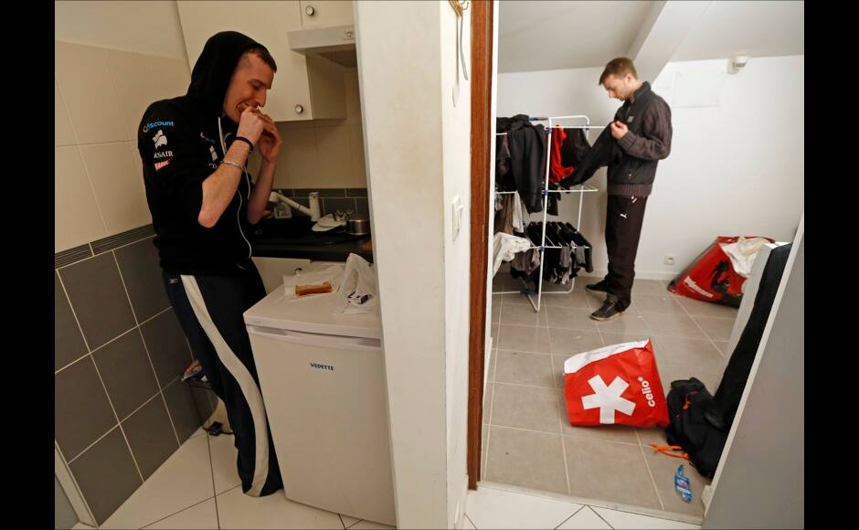 Millenium eSport professional gamer,Tony of France, nicknamed ShLaYa (L) eats a sandwich in his room as team mate Julien, nicknamed Juliianooo, puts away his belongings inside the Millenium Gaming House in Marseille November 12, 2013. The Millenium Gaming House, which opened its doors in Marseille in 2011, is the most important French e-sport organization and houses pro gamers who live, game, eat and sleep full-time in the building. The house is dedicated to the training of Pro Gamers teams for International competitions. Players train long hours to master the difficulties and subtleties of only one game and participate in Lan-Parties around the world. E-Sports earnings has ranked the 100 players with the highest overall earnings from competitive gaming, with over 60 gamers who have earned over $100,000 in prize money. Picture taken November 12, 2013. REUTERS/Jean-Paul Pelissier 