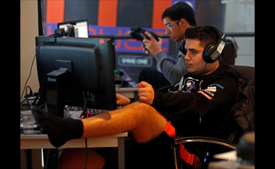 Millenium eSport professional gamer Arif of France, nicknamed Doigby, looks at a computer screen as he plays inside the Millenium Gaming House in Marseille Novembre 15, 2013. The Millenium Gaming House, which opened its doors in Marseille in 2011, is the most important French e-sport organization and houses pro gamers who live, game, eat and sleep full-time in the building. The house is dedicated to the training of Pro Gamers teams for International competitions. Players train long hours to master the difficulties and subtleties of only one game and participate in Lan-Parties around the world. E-Sports earnings has ranked the 100 players with the highest overall earnings from competitive gaming, with over 60 gamers who have earned over $100,000 in prize money. Picture taken November 15, 2013. REUTERS/Jean-Paul Pelissier