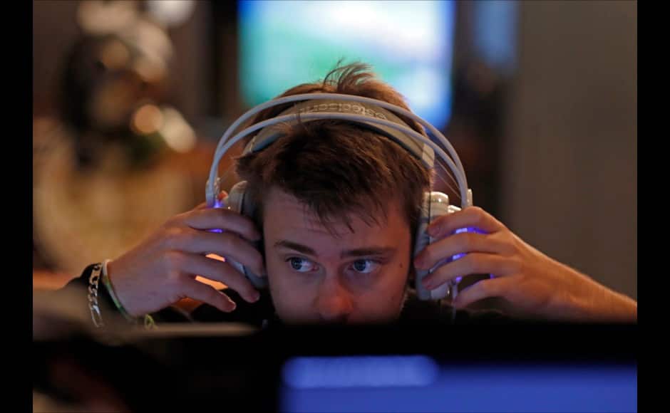 Millenium eSport professional gamer Cedric of France, nicknamed Crowmac, adjusts his headphone as he plays inside the Millenium Gaming House in Marseille November 13, 2013. The Millenium Gaming House, which opened its doors in Marseille in 2011, is the most important French e-sport organization and houses pro gamers who live, game, eat and sleep full-time in the building. The house is dedicated to the training of Pro Gamers teams for International competitions. Players train long hours to master the difficulties and subtleties of only one game and participate in Lan-Parties around the world. E-Sports earnings has ranked the 100 players with the highest overall earnings from competitive gaming, with over 60 gamers who have earned over $100,000 in prize money. Picture taken November 13, 2013. REUTERS/Jean-Paul Pelissier 