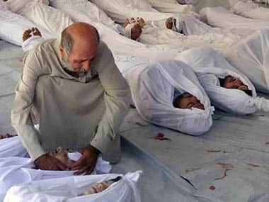 FILE - This Aug. 21, 2013, citizen journalism image provided by the Media Office Of Douma City which has been authenticated based on its contents and other AP reporting, shows a Syrian man mourning over a dead body after an alleged poisonous gas attack fired by regime forces, according to activists, in Douma town, Damascus, Syria. The tiny and impoverished Balkan nation of Albania was emerging Friday, Nov. 15, 2013 as a likely location for the destruction of Syria's chemical weapons stockpile. The Organization for the Prohibition of Chemical Weapons was discussing a plan to destroy its estimated 1,000-metric-ton arsenal, which includes mustard gas and the deadly nerve agent sarin. Syria says it wants the weapons destroyed outside the country and the OPCW has described that as the 