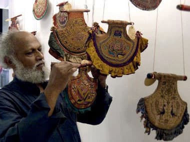 An artist had painting fans during an exhibition at the Victoria Memorial hall: AFP