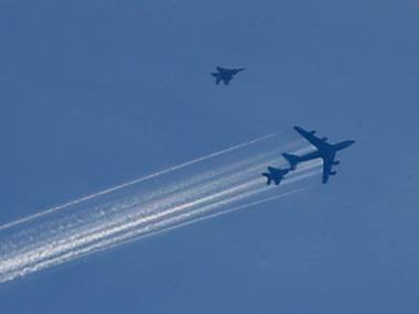 U.S. fighter jets fly near a military tanker aircraft during an aerial refueling run above Los Angeles. Reuters