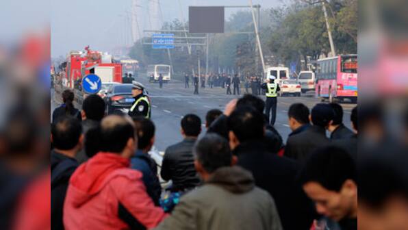 China: 1 killed, 8 injured in blasts outside Communist Party office 