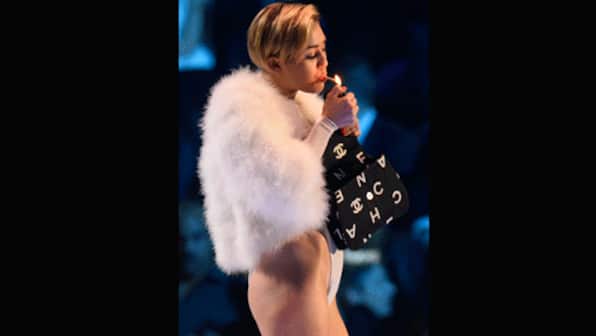 Miley Cyrus lights a joint at MTV EMAs 