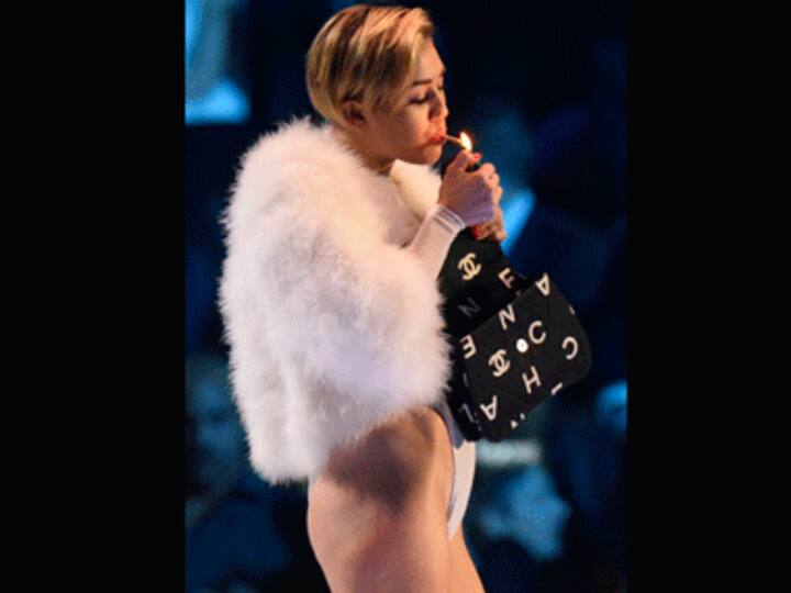 Miley Cyrus lights a joint at MTV EMAs 