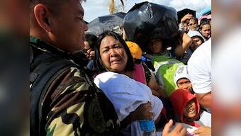 Typhoon Haiyan: Mass burial of victims begins